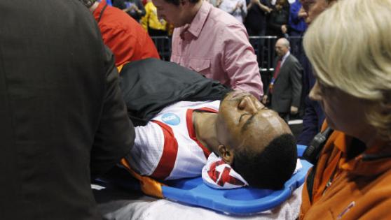 Ware being carried off the court minutes after the horrific injury. Credit: CBS